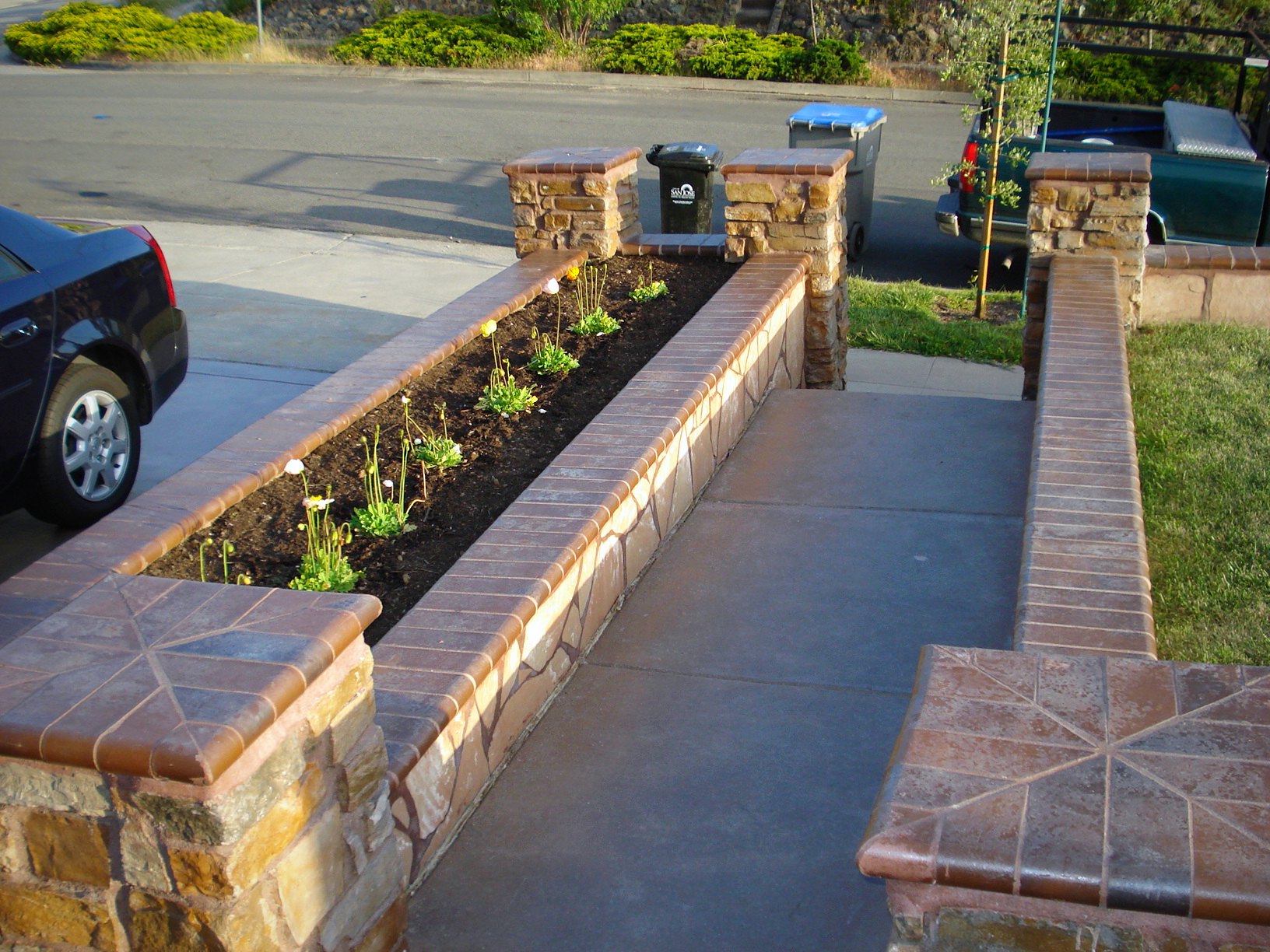 Stone veneer planter walls